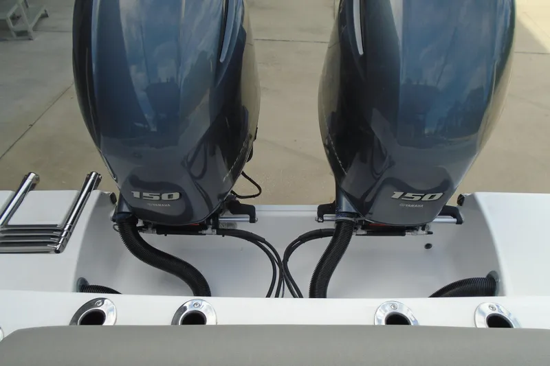 Slide: The Image of 2021 Sportsman Open 252 Center Console with dual Yamaha 150 engines, rear view. - 14