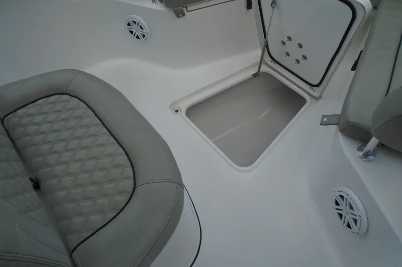 Slide: The Image of 2021 Sportsman Open 252 Center Console interior with open storage compartment and cushioned seating. - 15