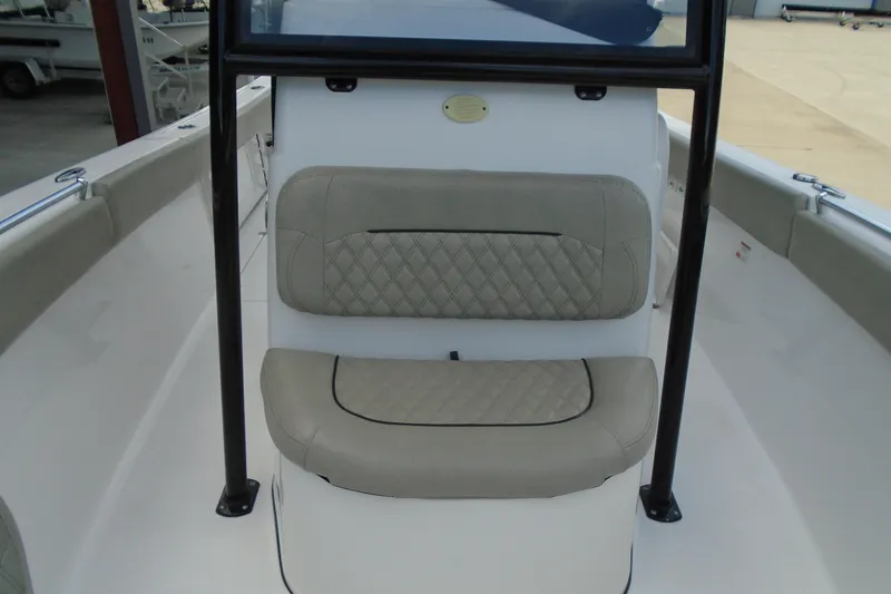 Slide: The Image of 2021 Sportsman Open 252 Center Console boat interior with cushioned seating. - 16