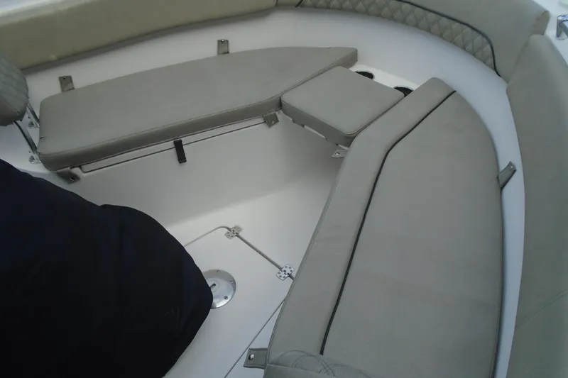 Slide: The Image of 2021 Sportsman Open 252 Center Console boat interior with cushioned seating. - 18