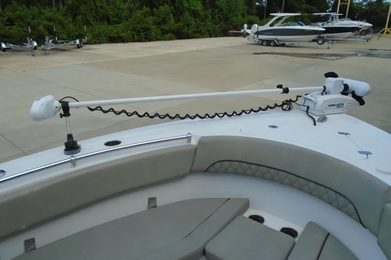 Slide: The Image of 2021 Sportsman Open 252 Center Console with Minn Kota trolling motor on deck. - 19