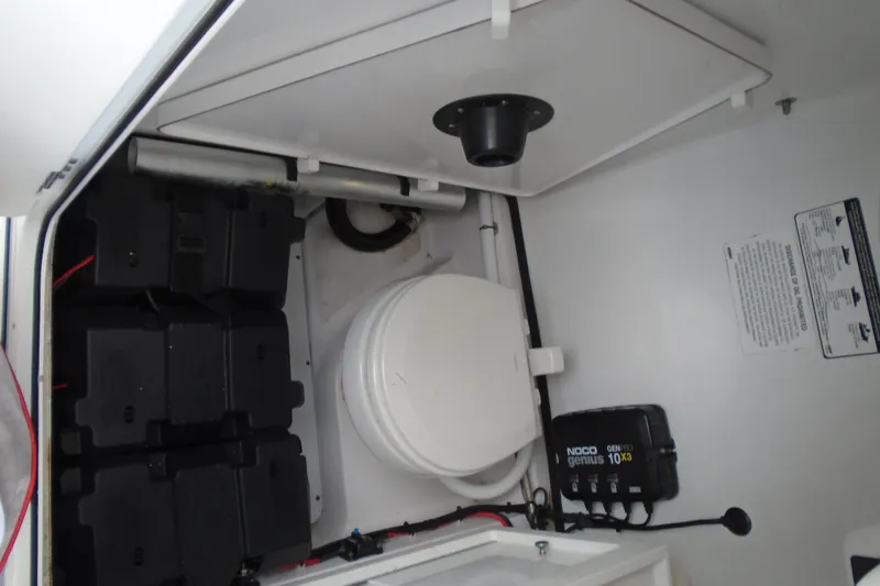 Slide: The Image of 2021 Sportsman Open 252 Center Console interior with battery storage and charging system. - 20