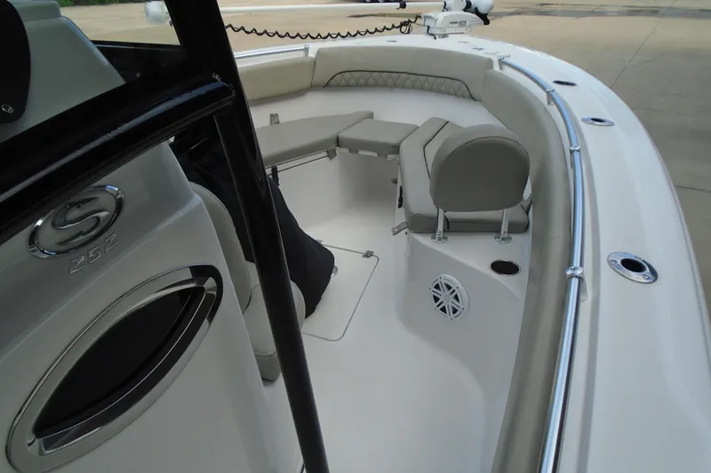 Slide: The Image of 2021 Sportsman Open 252 Center Console boat interior with seating and console details. - 22