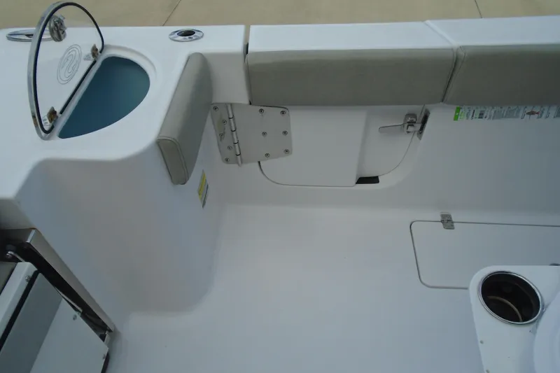 Slide: The Image of 2021 Sportsman Open 252 Center Console interior with seating and storage compartments. - 23