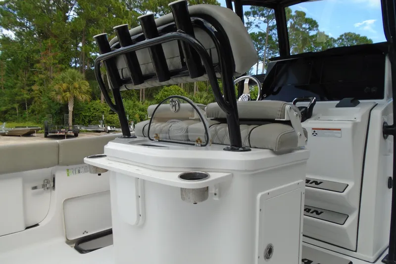Slide: The Image of 2021 Sportsman Open 252 Center Console boat interior with seating and rod holders. - 8
