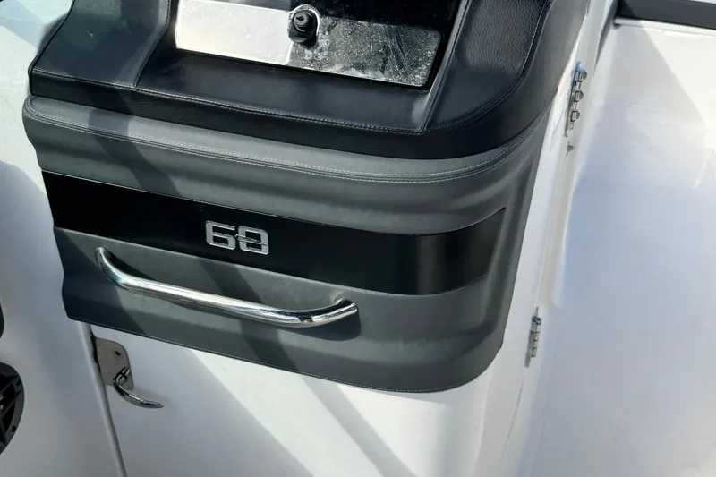 Slide: The Image of Control panel of 2025 Chaparral 250 OSX boat with handle and display. - 12