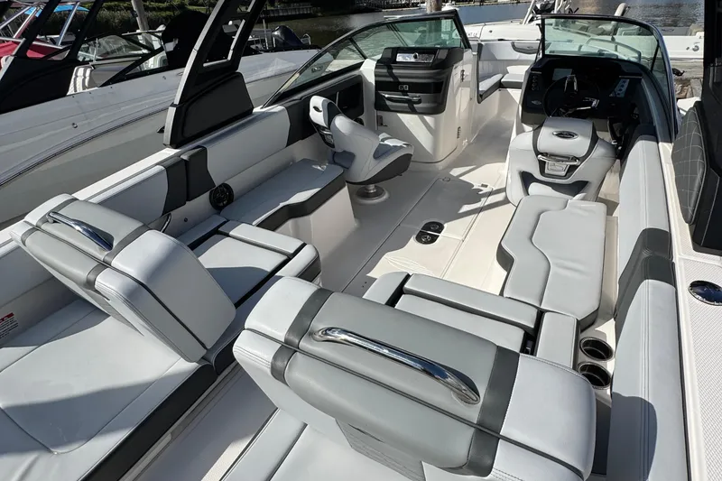 Slide: The Image of 2025 Chaparral 250 OSX boat interior with modern seating and sleek design. - 8