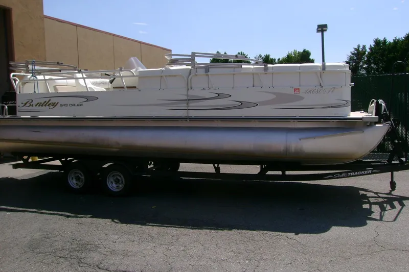 Slide: The Image of 2006 Bentley Pontoons 243 Cruise on trailer, parked outdoors. - 3