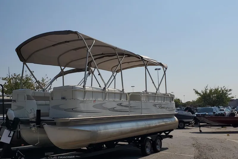 Slide: The Image of 2006 Bentley Pontoons 243 Cruise pontoon boat on trailer in parking lot. - 6