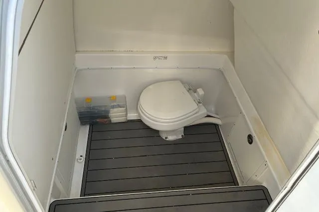 Slide: The Image of 2024 Cape Horn 34 XS boat interior with toilet and storage area. - 14