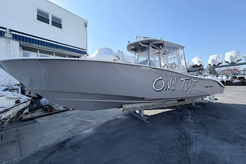The Image of 2024 Cape Horn 34 XS boat on display at a marina, labeled "OWN TIME." - 0