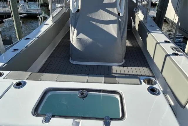 Slide: The Image of 2024 Cape Horn 34 XS boat deck with seating and storage compartments. - 5