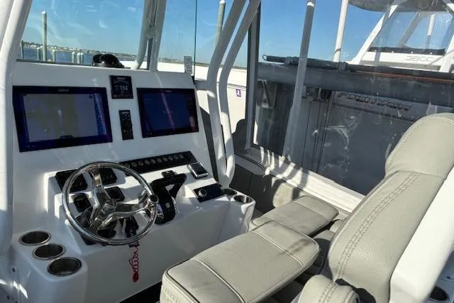 Slide: The Image of 2024 Cape Horn 34 XS boat cockpit with modern controls and comfortable seating. - 6