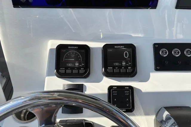 Slide: The Image of Dashboard of 2024 Cape Horn 34 XS boat with Suzuki gauges and controls. - 7