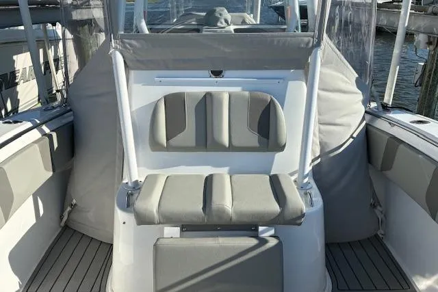 Slide: The Image of 2024 Cape Horn 34 XS boat interior with cushioned seating and sleek design. - 9