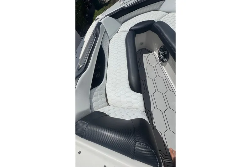 Slide: The Image of Interior of 2008 Regal 2520 FasDeck boat with hexagonal-patterned seating. - 15