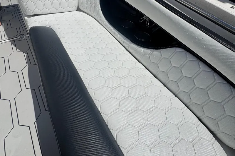 Slide: The Image of 2008 Regal 2520 FasDeck boat interior with hexagonal pattern seating and black accents. - 31