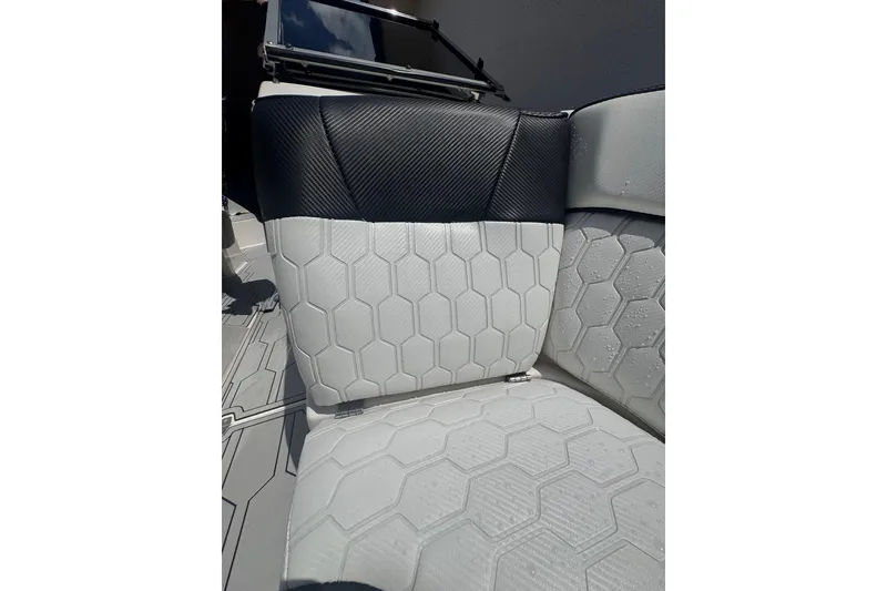 Slide: The Image of 2008 Regal 2520 FasDeck boat seat with hexagonal pattern and black accents. - 32