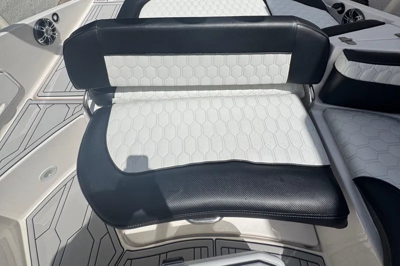 Slide: The Image of 2008 Regal 2520 FasDeck boat seat with black and white hexagonal pattern upholstery. - 33