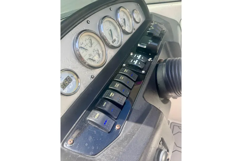 Slide: The Image of Dashboard of 2008 Regal 2520 FasDeck boat with gauges and switches. - 40