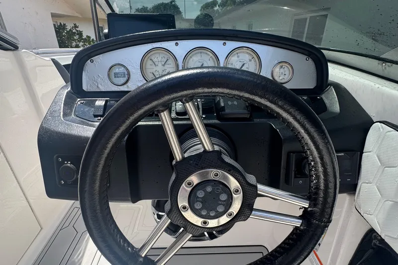 Slide: The Image of Steering wheel and dashboard of 2008 Regal 2520 FasDeck boat. - 41