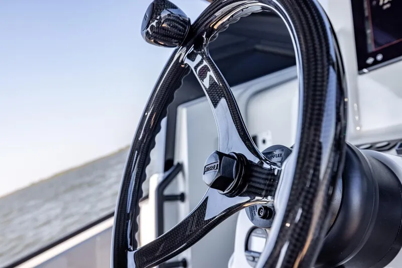 Slide: The Image of Close-up of 2025 Chaser 54 Laguna steering wheel, showcasing sleek design and craftsmanship. - 18