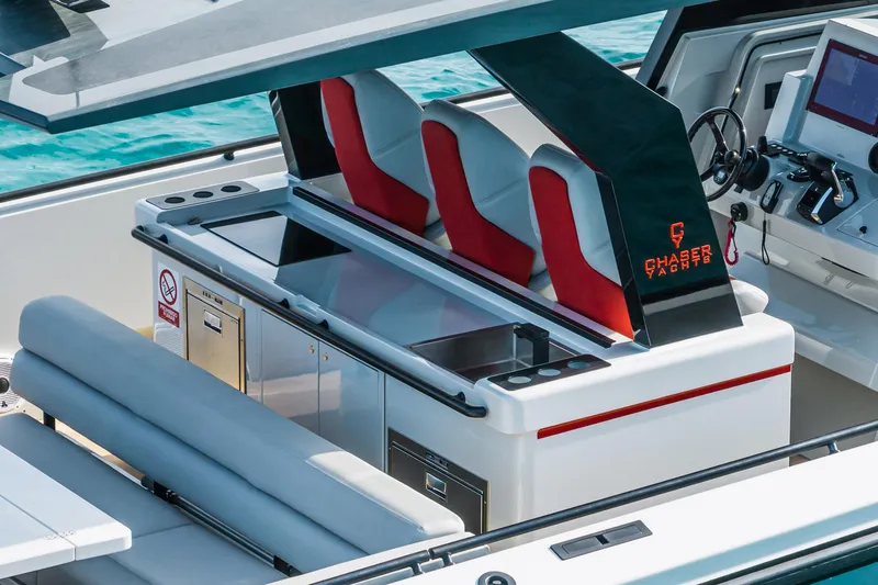Slide: The Image of 2023 Chaser 54 Laguna yacht interior with modern seating and control panel. - 22