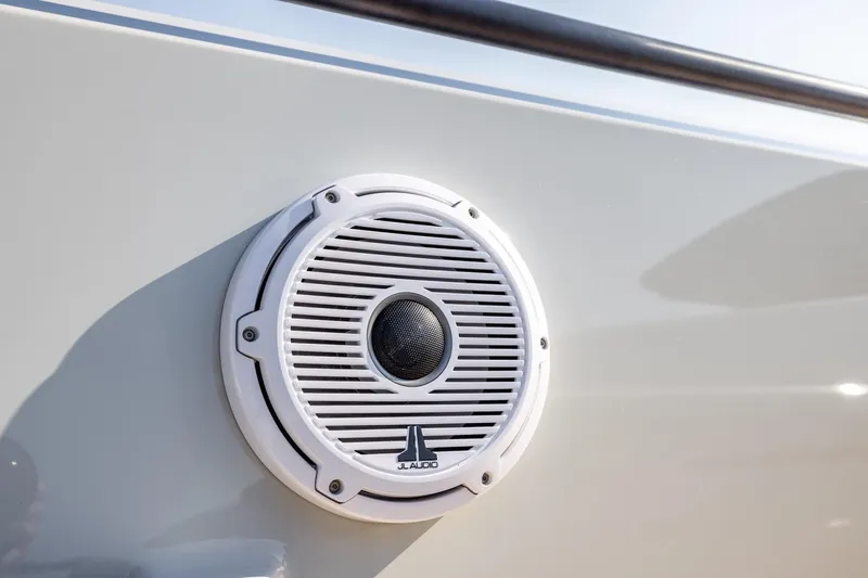 Slide: The Image of White JL Audio speaker on 2025 Chaser 54 Laguna boat exterior. - 27