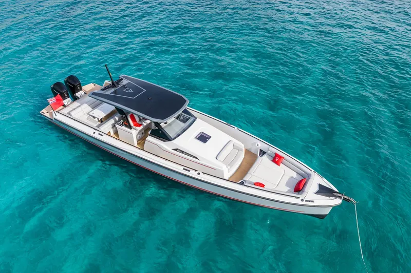 Slide: The Image of 2023 Chaser 54 Laguna boat on clear turquoise water. - 32