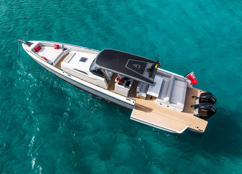 Slide: The Image of 2023 Chaser 54 Laguna yacht on clear turquoise water, aerial view. - 35