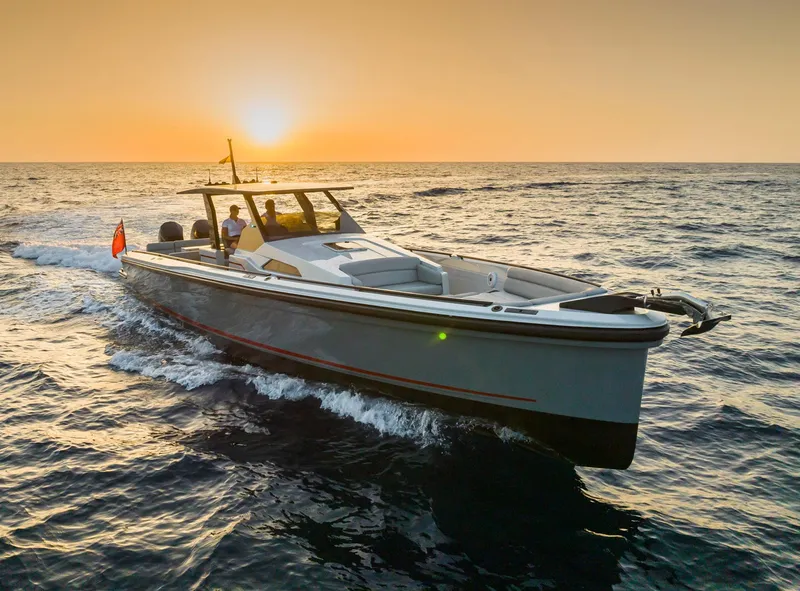 Slide: The Image of 2023 Chaser 54 Laguna yacht cruising at sunset on open sea. - 38