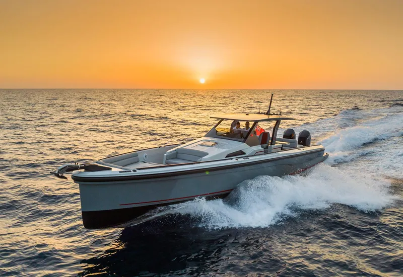 Slide: The Image of 2023 Chaser 54 Laguna boat cruising at sunset on open water. - 39