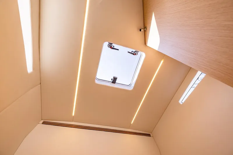 Slide: The Image of Interior ceiling of 2025 Chaser 54 Laguna yacht with modern lighting and hatch. - 6