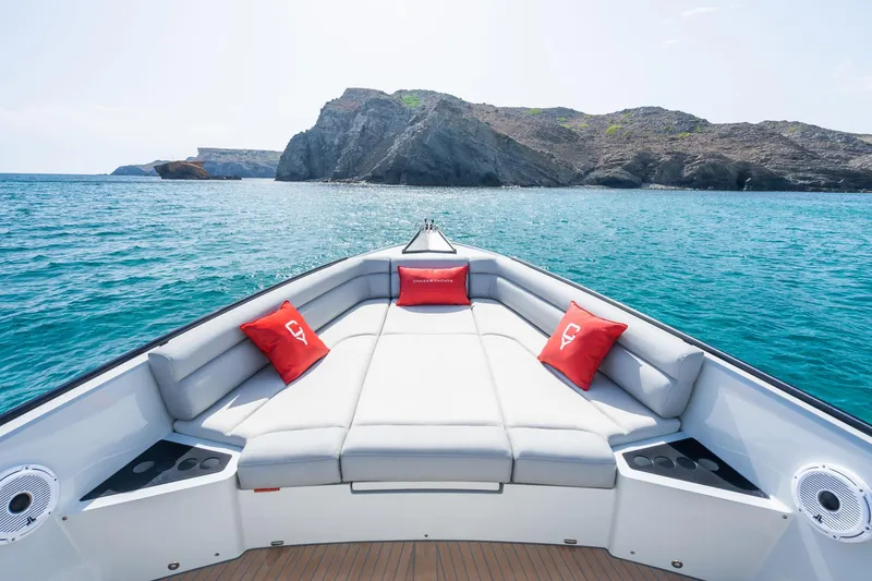 Slide: The Image of Luxurious 2023 Chaser 54 Laguna yacht with scenic ocean and rocky island view. - 9