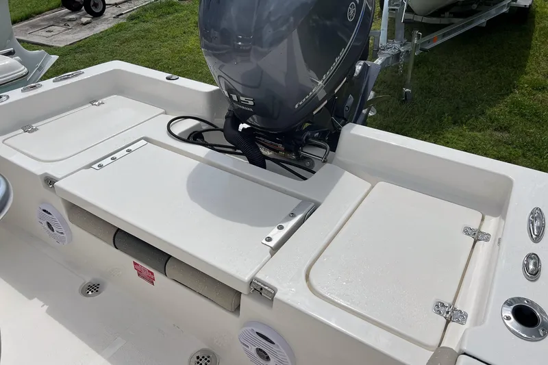 Slide: The Image of 2026 Key West 179 FS boat interior with steering wheel and cushioned seat. - 6