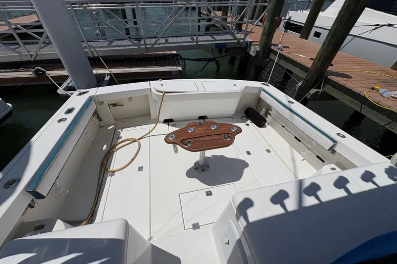 Slide: The Image of 2006 Rampage 38 Express boat deck with fishing chair and dock view. - 13