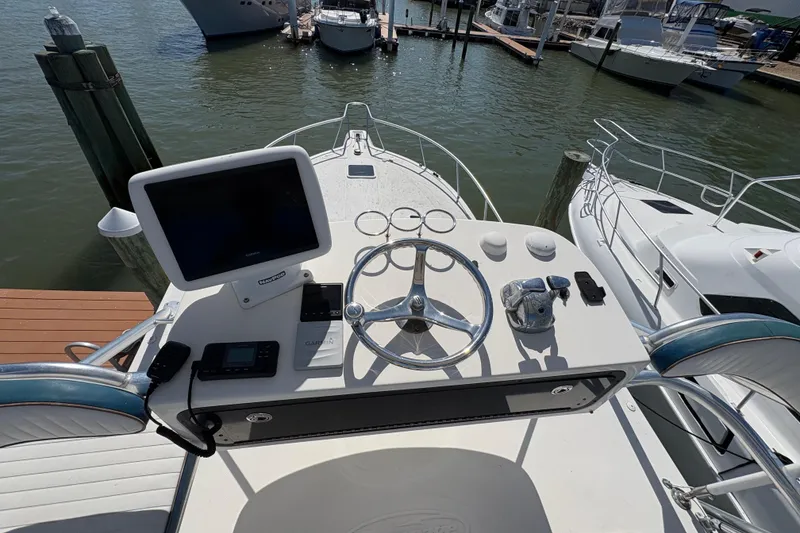 Slide: The Image of Helm of 2006 Rampage 38 Express boat with navigation equipment and steering wheel. - 20