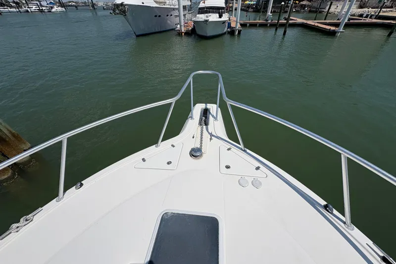 Slide: The Image of Bow view of 2006 Rampage 38 Express yacht docked in marina. - 8