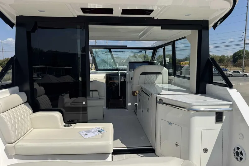 Slide: The Image of 2026 Regal 36 Grande Coupe interior with luxurious seating and modern amenities. - 13