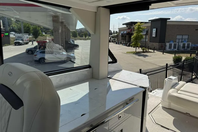 Slide: The Image of Interior view of 2026 Regal 36 Grande Coupe at a gas station. - 18