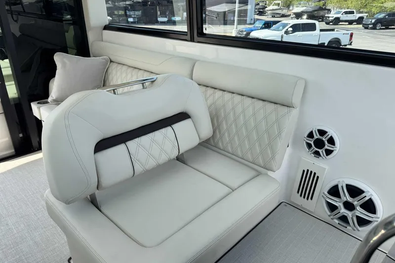 Slide: The Image of Luxurious interior seating of 2026 Regal 36 Grande Coupe with elegant design and speakers. - 20