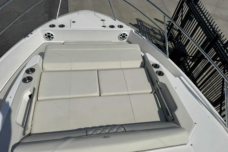 Slide: The Image of 2026 Regal 36 Grande Coupe boat with spacious sunbathing area and cup holders. - 21
