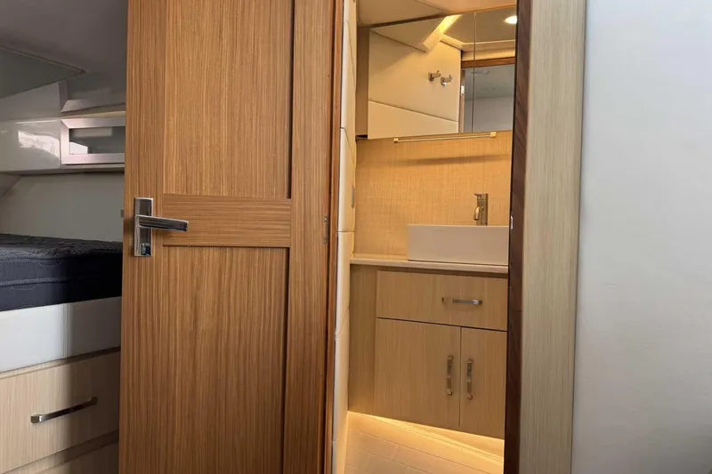 Slide: The Image of Interior of 2026 Regal 36 Grande Coupe, featuring a modern bathroom and cozy bedroom. - 28