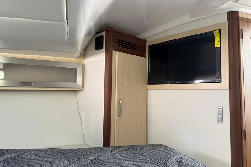 Slide: The Image of Interior of 2026 Regal 36 Grande Coupe with TV and modern cabinetry. - 32