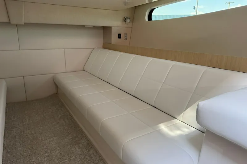 Slide: The Image of Luxurious interior of 2026 Regal 36 Grande Coupe with white leather seating. - 36