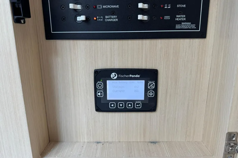 Slide: The Image of Control panel of a 2026 Regal 36 Grande Coupe with Fischer Panda display. - 38