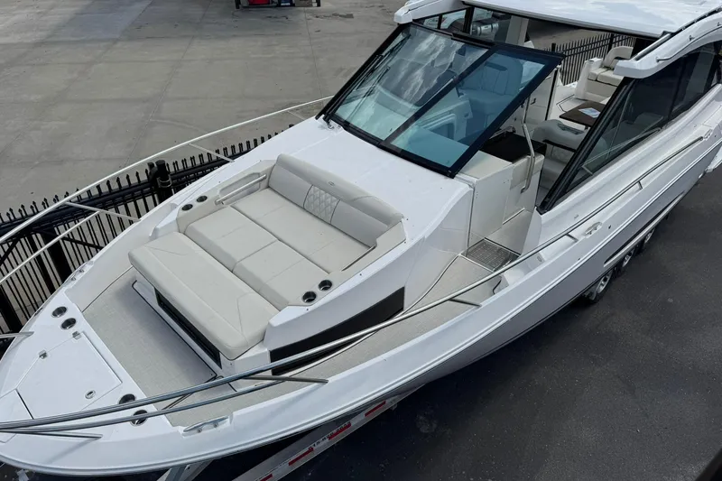 Slide: The Image of 2026 Regal 36 Grande Coupe boat with spacious seating and sleek design. - 4