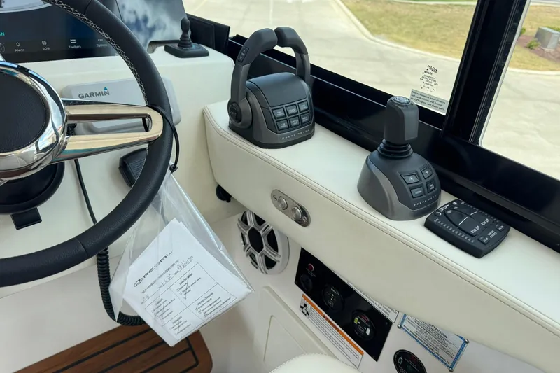 Slide: The Image of Helm of 2026 Regal 36 Grande Coupe with Garmin controls and joystick. - 41