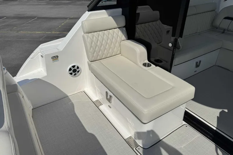 Slide: The Image of Luxurious seating area on the 2026 Regal 36 Grande Coupe yacht, featuring elegant upholstery. - 8