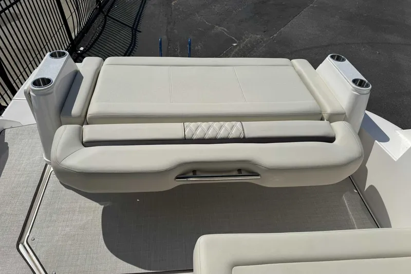 Slide: The Image of Luxurious seating on 2026 Regal 36 Grande Coupe boat with cup holders. - 9